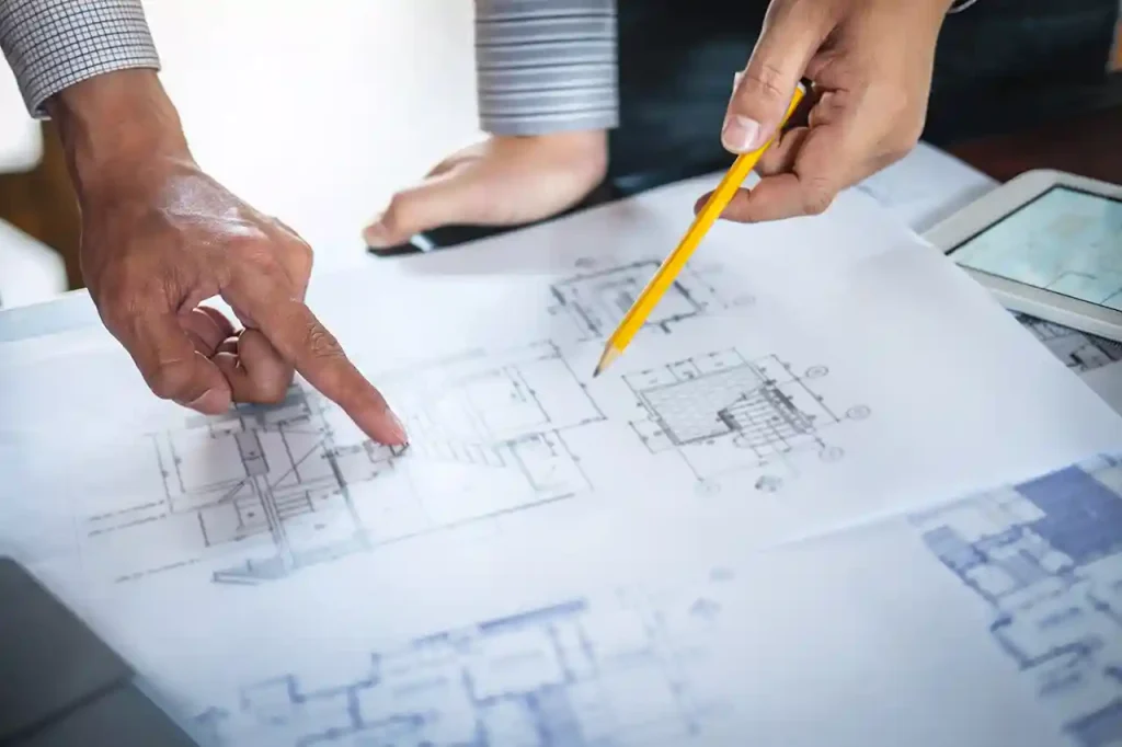 Building professionals reviewing plans for a commercial HVAC and indoor air quality project